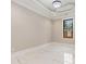 Spacious bedroom with a tray ceiling, pot lights, a single window and marble floors at 1559 Old Tram Rd., Little River, SC 29566
