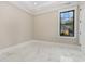 Bright bedroom with marble floors, a dark trimmed window, and modern fixtures at 1559 Old Tram Rd., Little River, SC 29566