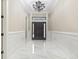 Elegant foyer with marble floors, wainscoting, and a decorative chandelier for a grand entrance at 1559 Old Tram Rd., Little River, SC 29566