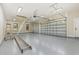 This spacious garage features epoxy floors, recessed lighting, and two car-garage doors at 1559 Old Tram Rd., Little River, SC 29566