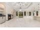 Expansive living room with a fireplace, recessed lighting, and large windows offering abundant natural light at 1559 Old Tram Rd., Little River, SC 29566