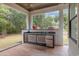 This outdoor kitchen features granite countertops, stainless steel appliances, and ample space for entertaining at 1559 Old Tram Rd., Little River, SC 29566