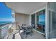 Open balcony with a table and chairs overlooking the beautiful ocean at 1625 S Ocean Blvd. # 1604, North Myrtle Beach, SC 29582