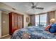 Comfortable bedroom with balcony access and ocean views, featuring a ceiling fan and ample closet space at 1625 S Ocean Blvd. # 1604, North Myrtle Beach, SC 29582