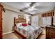 This bedroom features a bed with patterned bedding, ceiling fan, and furniture at 1625 S Ocean Blvd. # 1604, North Myrtle Beach, SC 29582