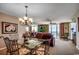 Comfortable dining room showcasing a glass-top table, seating for six, and direct access to a balcony at 1625 S Ocean Blvd. # 1604, North Myrtle Beach, SC 29582