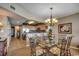 Dining room with a glass-top table, chairs, and an adjacent kitchen with stainless steel appliances at 1625 S Ocean Blvd. # 1604, North Myrtle Beach, SC 29582