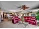 Inviting living area with leather seating, a decorative fan, and an open floor plan leading to the kitchen at 1625 S Ocean Blvd. # 1604, North Myrtle Beach, SC 29582