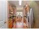 Galley kitchen with stainless steel appliances, granite countertops, and view into dining area at 1631 Low Country Pl. # E, Myrtle Beach, SC 29577