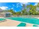 Community pool with lounge chairs and blue skies at 1631 Low Country Pl. # E, Myrtle Beach, SC 29577