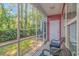 Screened-in porch with outdoor seating and views of the yard at 1631 Low Country Pl. # E, Myrtle Beach, SC 29577