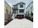 Two-story home boasting a modern design, prominent black trim, and a spacious concrete driveway at 168 West Palms Dr., Myrtle Beach, SC 29579