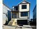New construction with a staircase leading to the front door and a black garage door at 168 West Palms Dr., Myrtle Beach, SC 29579