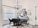 Bright dining room showcases decorative lighting and a modern table setting at 1856 Melville Ct., Little River, SC 29566