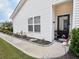 Charming home exterior with well-manicured landscaping and a welcoming front entrance at 1856 Melville Ct., Little River, SC 29566