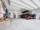 Spacious garage with ample storage space, golf cart, and overhead lighting at 1856 Melville Ct., Little River, SC 29566