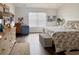 Inviting main bedroom with a large window and hardwood floors at 1856 Melville Ct., Little River, SC 29566