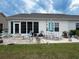 Outdoor patio with seating, fire pit, and an open view of the yard and sky at 1856 Melville Ct., Little River, SC 29566
