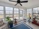 Bright sunroom filled with natural light, cozy seating, and views of the backyard at 1856 Melville Ct., Little River, SC 29566