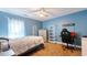 Bedroom with blue paint, carpet, ceiling fan, and desk with a gamer chair at 190 Hamilton Way, Conway, SC 29526