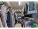 Walk-in closet with clothing hanging on both sides and shoe storage at the end at 190 Hamilton Way, Conway, SC 29526