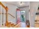 Entryway with wood floors, red door and staircase leading to the upper level at 190 Hamilton Way, Conway, SC 29526