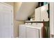 Well-equipped laundry area featuring a washer and dryer with overhead cabinets at 190 Hamilton Way, Conway, SC 29526