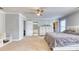A spacious main bedroom with neutral carpeting, a ceiling fan, and a walk-in closet at 190 Hamilton Way, Conway, SC 29526