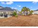 Community area featuring a picnic area and barbeque grills, with multiple residential buildings in the background at 2000 Cross Gate Blvd. # 104, Surfside Beach, SC 29575