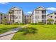 Beautiful condo building with lush green grass and landscaping at 2000 Cross Gate Blvd. # 104, Surfside Beach, SC 29575