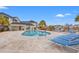 Community pool area with lounge chairs, and a serene water view at 2000 Cross Gate Blvd. # 104, Surfside Beach, SC 29575