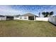 Wide backyard with covered patio, privacy fence, grassy lawn, and convenient storage shed at 203 Golden Bear Circle, Longs, SC 29568