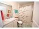 Bright bathroom with a vanity, framed mirror, and a shower with a decorative curtain at 203 Golden Bear Circle, Longs, SC 29568