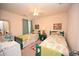 Shared bedroom with two beds, and a matching nightstand at 203 Golden Bear Circle, Longs, SC 29568