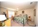 Cozy bedroom with a decorative metal bed frame and natural light from the window at 203 Golden Bear Circle, Longs, SC 29568
