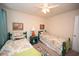 Charming bedroom featuring twin beds, colorful paisley bedding, and bright teal accents at 203 Golden Bear Circle, Longs, SC 29568