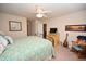 Relaxing bedroom with a TV, rocking chair, and a decorative bed at 203 Golden Bear Circle, Longs, SC 29568