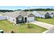 View of a home with brick and siding, front lawn landscaping, and a two-car garage with long driveway at 203 Golden Bear Circle, Longs, SC 29568