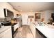 Functional kitchen with stainless steel appliances, neutral countertops, and a convenient layout for meal preparation at 203 Golden Bear Circle, Longs, SC 29568