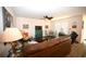 Inviting living room featuring a ceiling fan and a comfortable leather sofa at 203 Golden Bear Circle, Longs, SC 29568