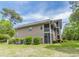 Exterior view of the property showing spacious screened in porches and manicured grounds at 227 Pinehurst Ln. # 6D, Pawleys Island, SC 29585