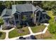 Aerial view of condo building showcasing balconies, landscaping, and parking at 227 Pinehurst Ln. # 6D, Pawleys Island, SC 29585