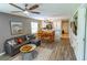 Open-concept living area with modern furniture and view of kitchen and dining spaces at 227 Pinehurst Ln. # 6D, Pawleys Island, SC 29585