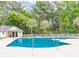 Community pool area with chairs and umbrellas at 227 Pinehurst Ln. # 6D, Pawleys Island, SC 29585