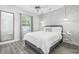 Stylish bedroom featuring modern decor, a comfortable bed, and ample natural light at 2409 Seabreeze Pl., Myrtle Beach, SC 29577