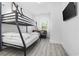 Cozy bedroom with a bunk bed, futon and a TV for ultimate relaxation and entertainment at 2409 Seabreeze Pl., Myrtle Beach, SC 29577