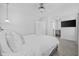 Spacious bedroom featuring a ceiling fan, television, and convenient ensuite access at 2409 Seabreeze Pl., Myrtle Beach, SC 29577