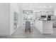 Bright dining area featuring a white table set, natural light, and modern finishes at 2409 Seabreeze Pl., Myrtle Beach, SC 29577