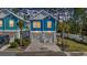 Charming blue two-story home with white trim, garage and neatly landscaped yard at 2409 Seabreeze Pl., Myrtle Beach, SC 29577