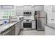 Modern kitchen features stainless steel appliances and granite countertops at 2409 Seabreeze Pl., Myrtle Beach, SC 29577